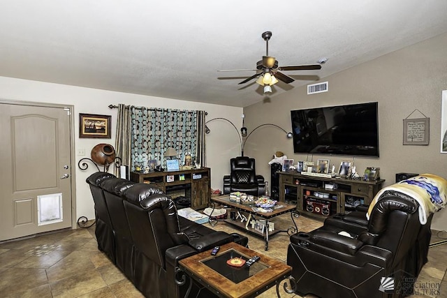 living room featuring ceiling fan and lofted ceiling