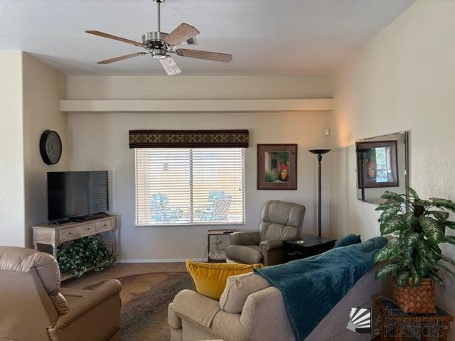 living room with ceiling fan