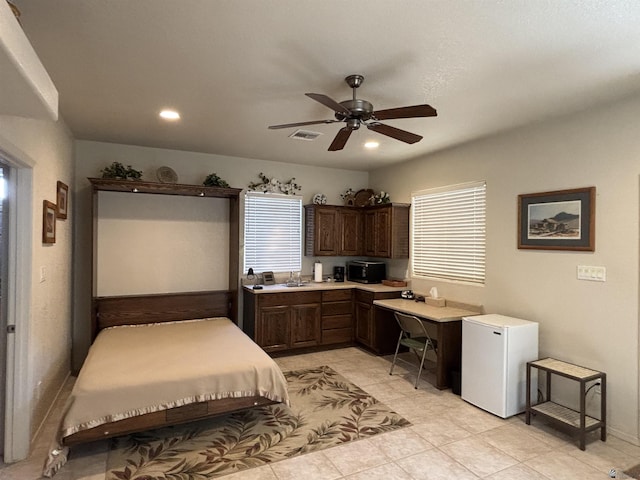 bedroom with recessed lighting, visible vents, ceiling fan, a sink, and fridge