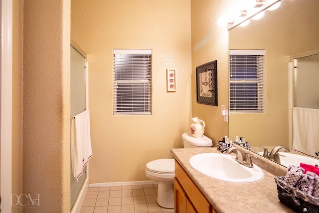 bathroom with toilet, vanity, tile patterned floors, and a shower with door