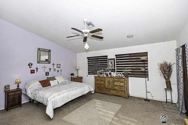 carpeted bedroom with lofted ceiling, a textured ceiling, and ceiling fan