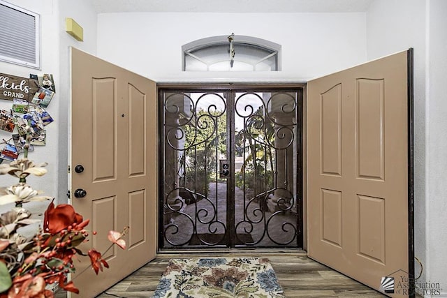 entryway featuring light hardwood / wood-style flooring and french doors