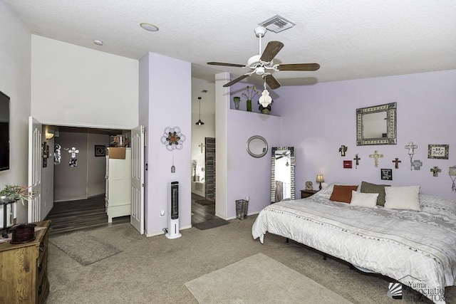 bedroom featuring high vaulted ceiling, carpet flooring, a textured ceiling, and ceiling fan