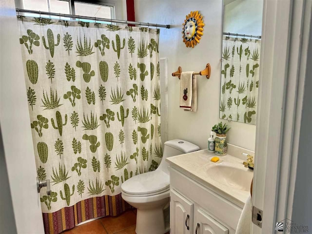 bathroom featuring toilet, tile patterned floors, a shower with curtain, and vanity