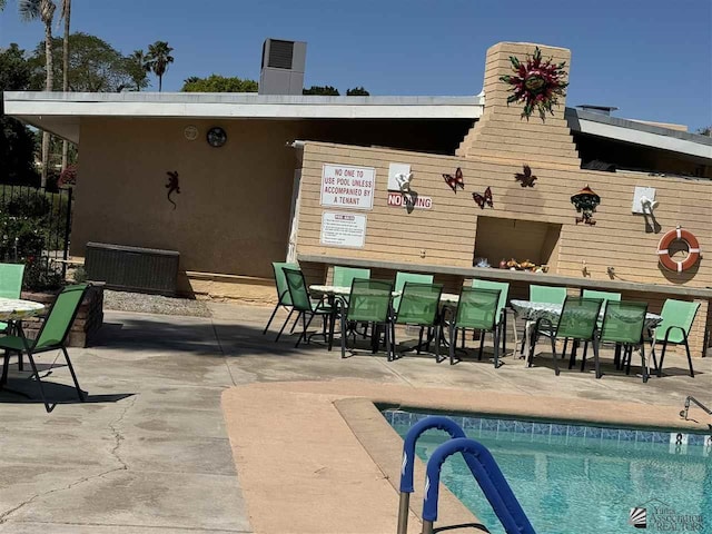 pool featuring a patio