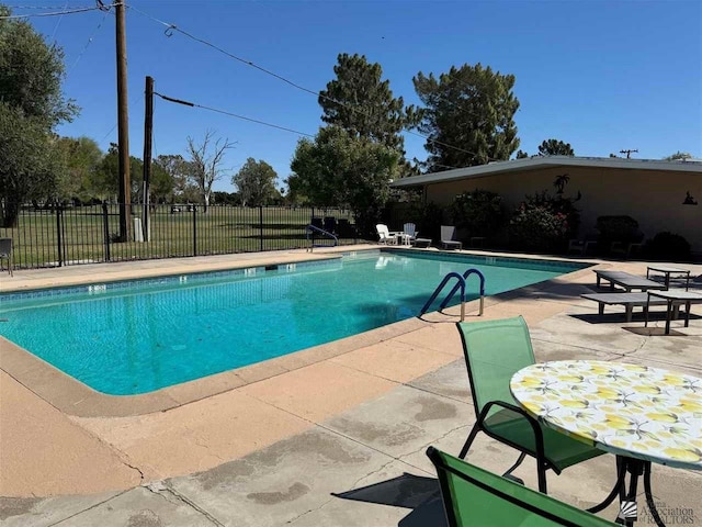 view of pool featuring a patio area, fence, and a fenced in pool