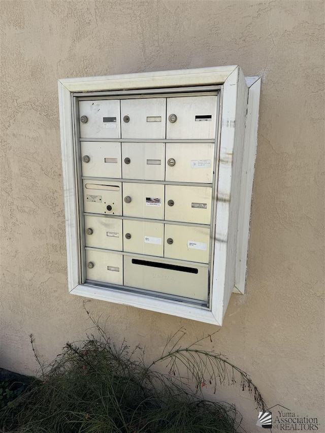 exterior details with mail area and stucco siding