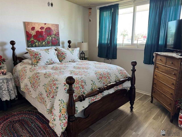 bedroom with light wood finished floors