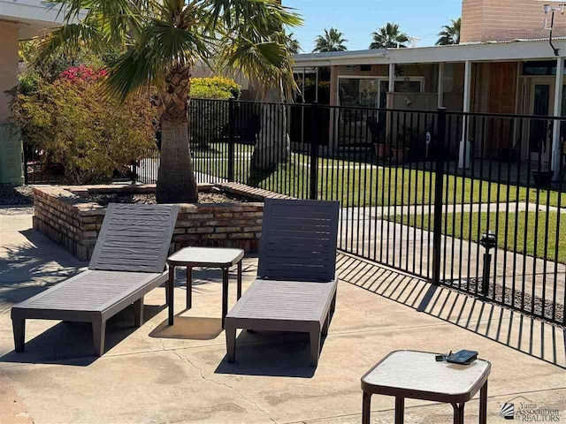 view of patio featuring fence