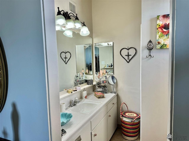 bathroom with visible vents and vanity