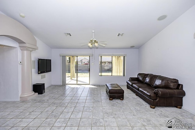 living room with ceiling fan, decorative columns, and light tile patterned floors