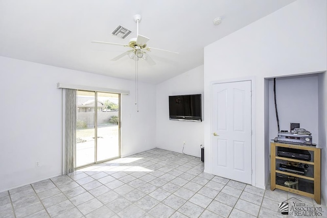 unfurnished living room featuring lofted ceiling, ceiling fan, and light tile patterned flooring