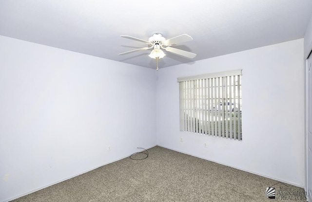 unfurnished room with carpet flooring and ceiling fan