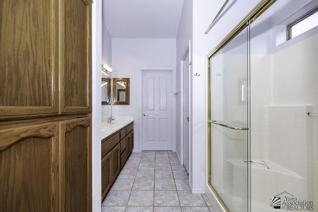 bathroom with vanity, tile patterned floors, and walk in shower