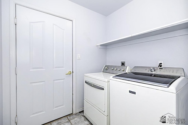 washroom with light tile patterned flooring and independent washer and dryer