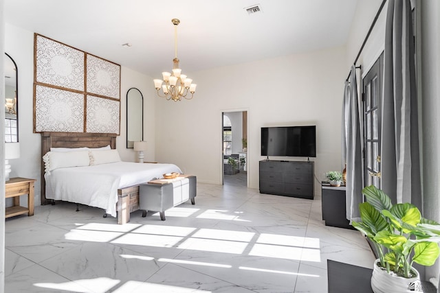 bedroom featuring a notable chandelier