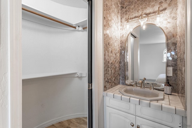 bathroom featuring vanity and hardwood / wood-style flooring