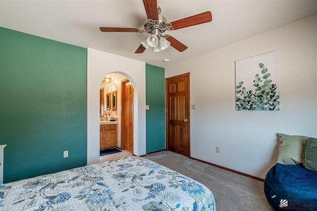 bedroom featuring a textured ceiling, ceiling fan, and carpet