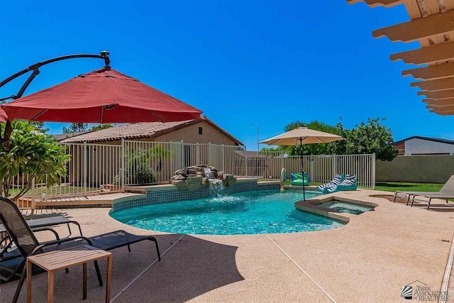 view of swimming pool with an in ground hot tub and a patio area