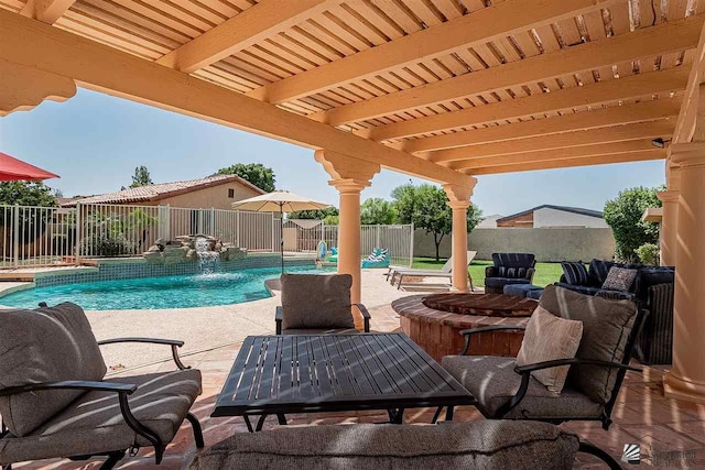 view of patio with a fenced in pool and pool water feature