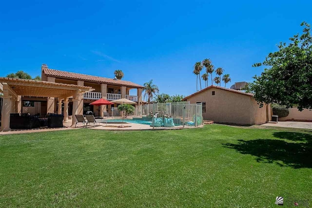 view of yard with a fenced in pool, a patio area, and a pergola