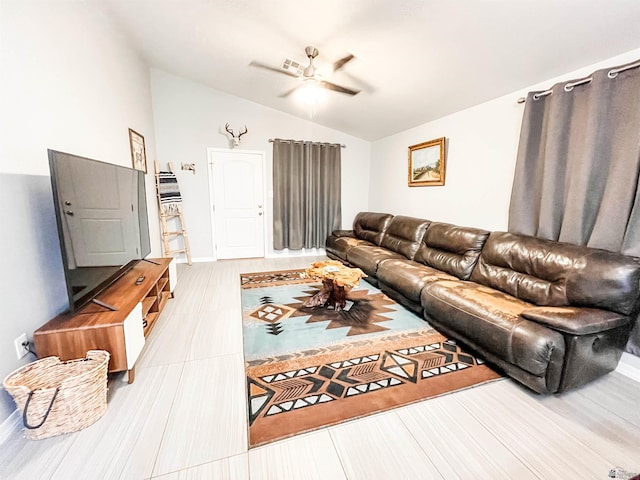 living room with ceiling fan and vaulted ceiling