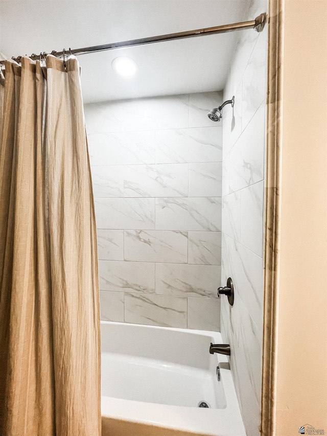 bathroom featuring shower / tub combo with curtain