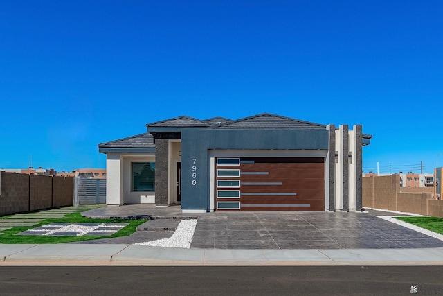 view of front of property with a garage