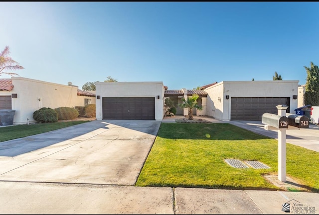 southwest-style home with a garage and a front lawn