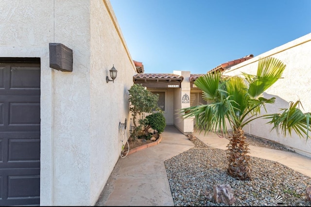 doorway to property featuring a garage