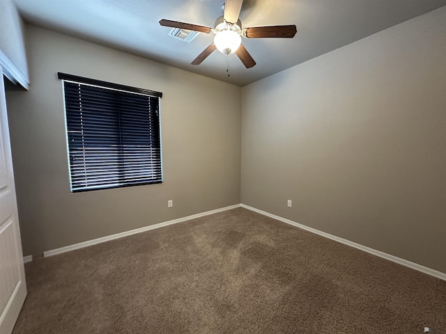 carpeted empty room with ceiling fan