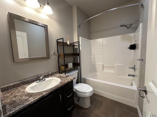 full bathroom featuring vanity, shower / bathing tub combination, tile patterned floors, and toilet