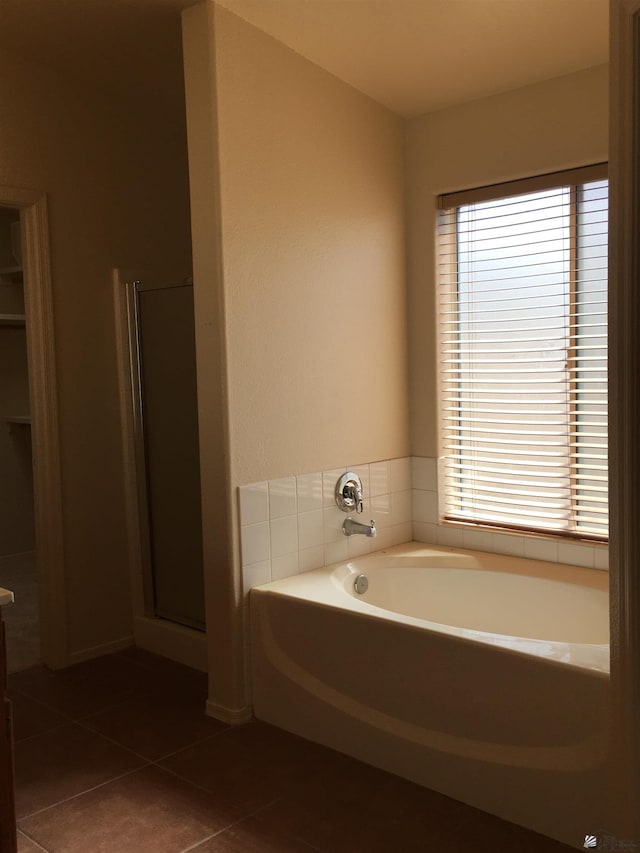 bathroom featuring separate shower and tub and tile patterned flooring