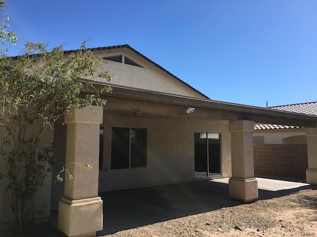 back of house with a patio