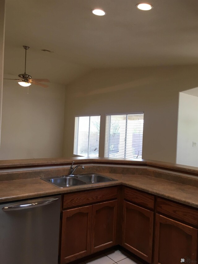 kitchen featuring ceiling fan, dishwasher, light tile patterned floors, and sink