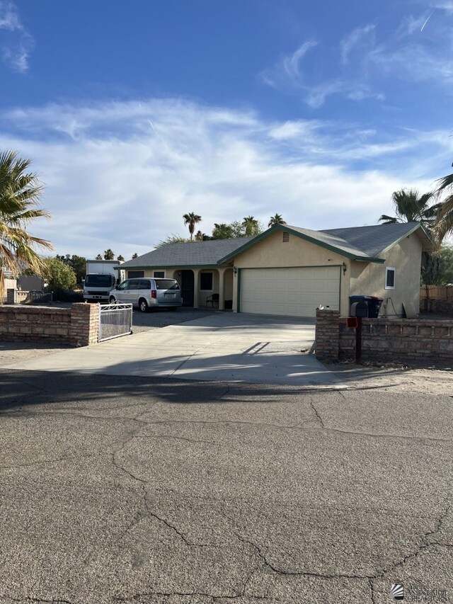 single story home with a garage