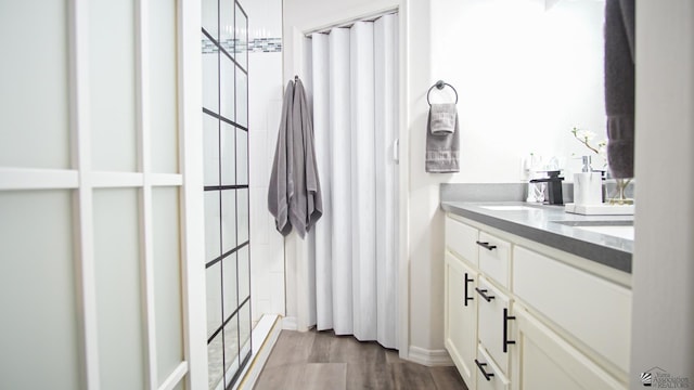 bathroom featuring hardwood / wood-style floors and vanity