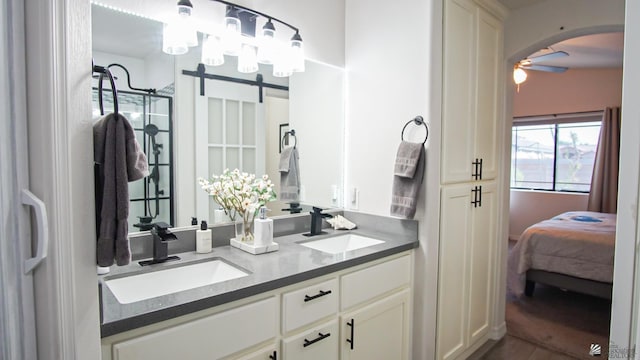 bathroom featuring ceiling fan and vanity