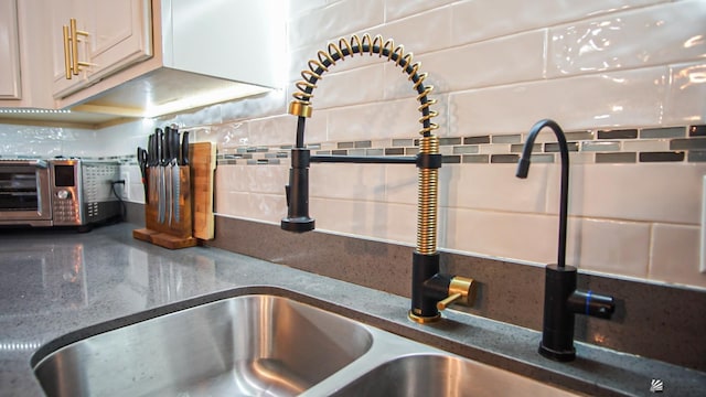 interior details with tasteful backsplash and sink