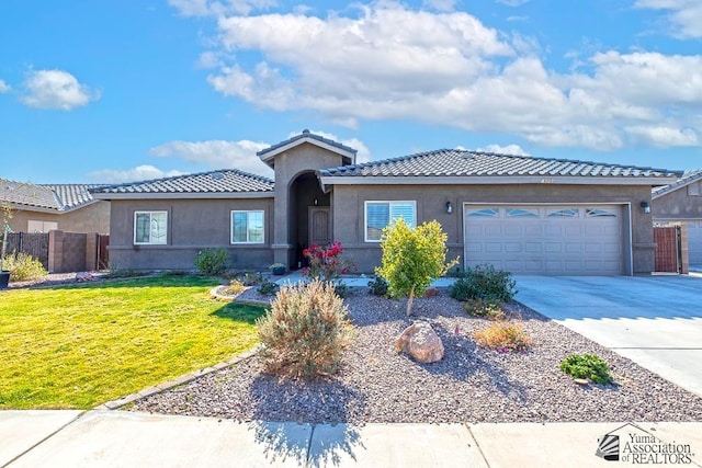 view of front facade with a garage and a front yard