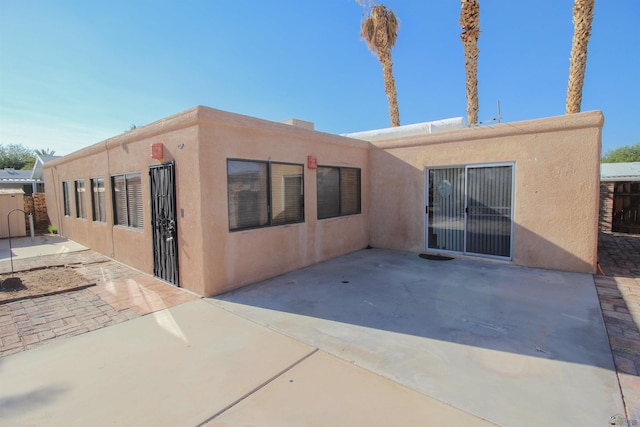 back of property with a patio area