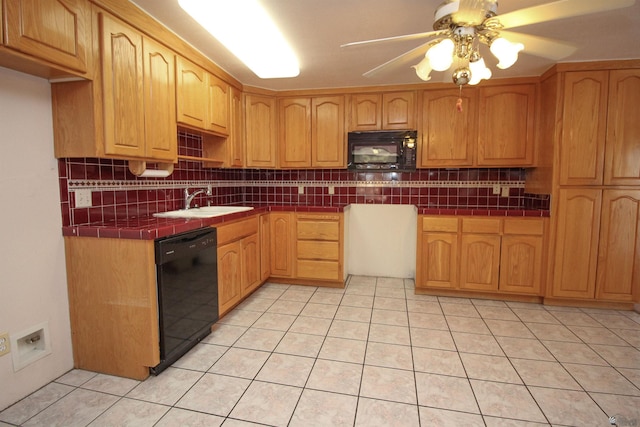 kitchen featuring ceiling fan, tasteful backsplash, tile countertops, light tile patterned floors, and black appliances