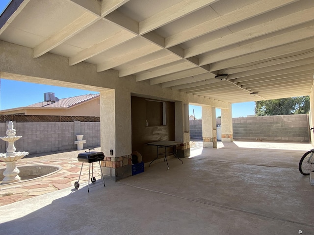 view of patio / terrace featuring fence