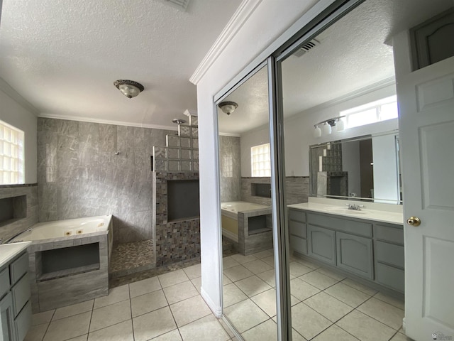 bathroom with ornamental molding, tile walls, a textured ceiling, and tile patterned floors