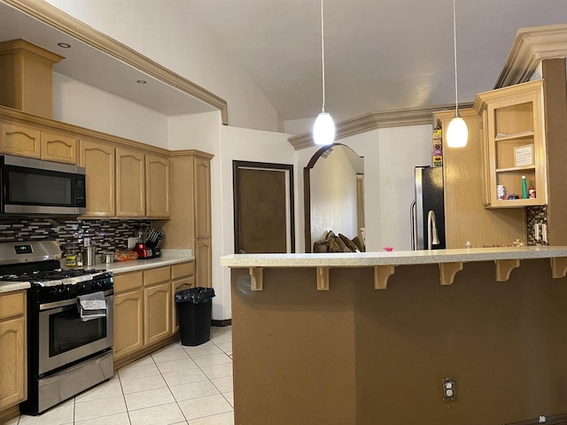 kitchen featuring appliances with stainless steel finishes, a kitchen breakfast bar, decorative light fixtures, light countertops, and open shelves