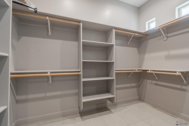 spacious closet with light tile patterned flooring