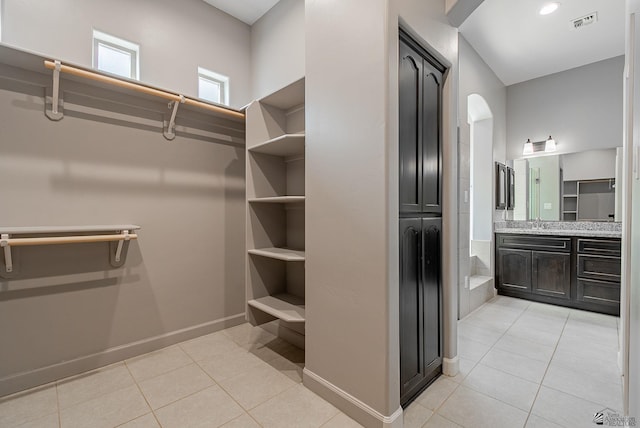 walk in closet with light tile patterned floors and visible vents