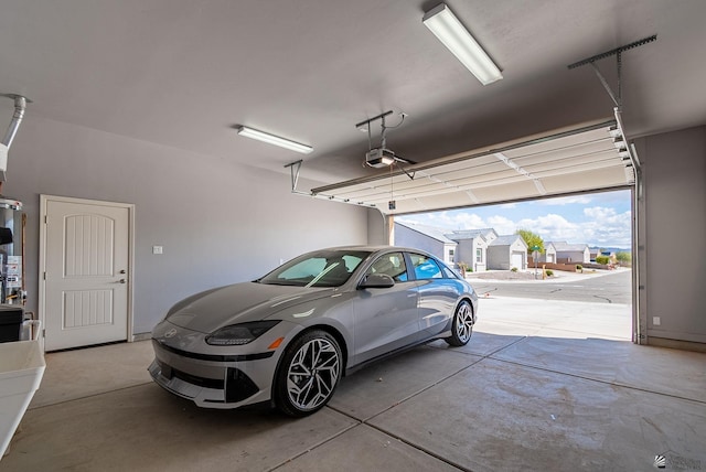 garage featuring a residential view and a garage door opener