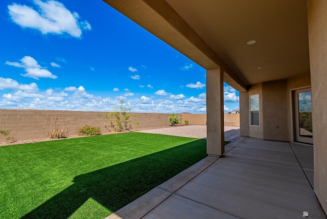 view of yard with a patio and a fenced backyard