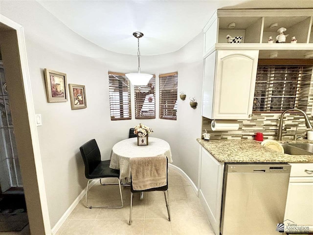 dining room with sink and light tile patterned floors